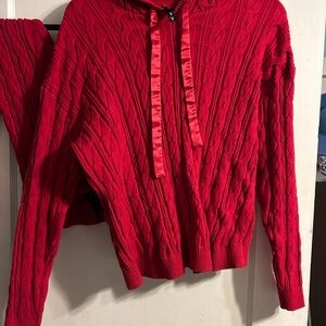 Torrid Red Cable Knit Sweater and cable knit leggings.